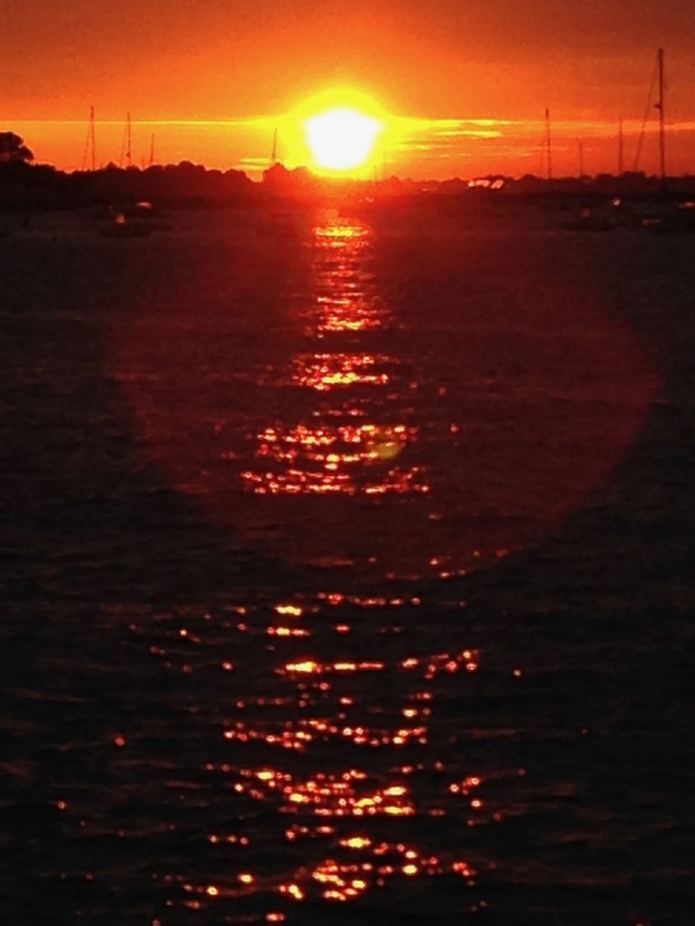 dark orange sun glow on water